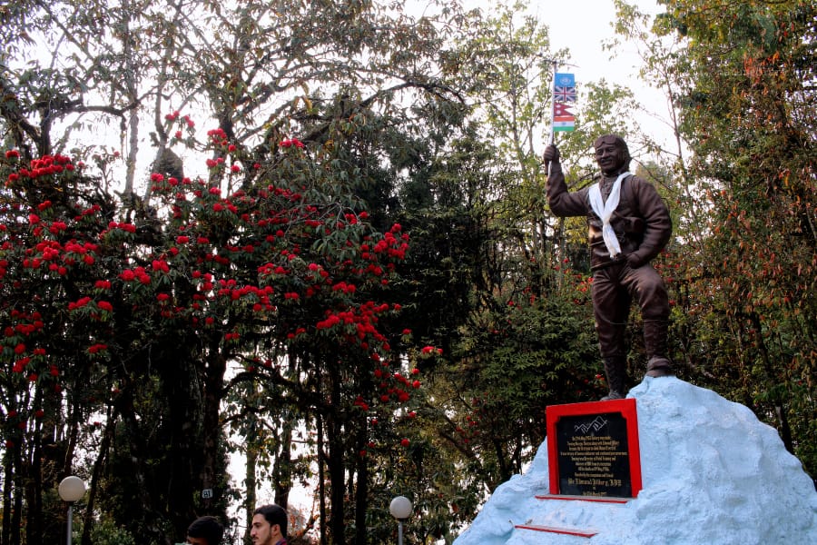 statue of Sherpa Tenzing Norgay standing with four flags