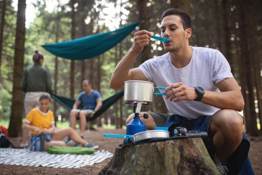 Using camping stove during a camping trip