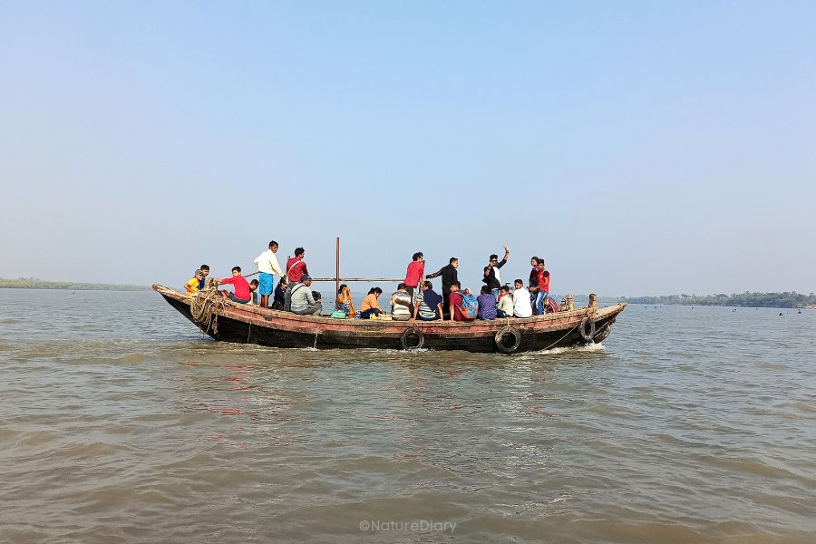 Crossing Chinai river on boat